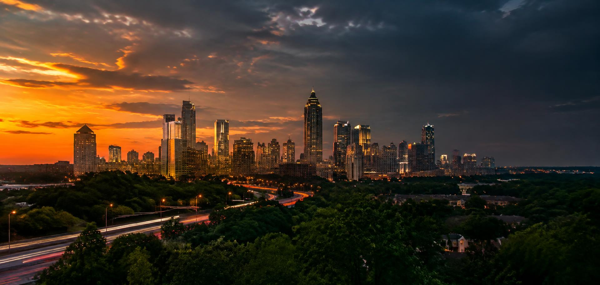 Atlanta skyline at sunset with highway light trails